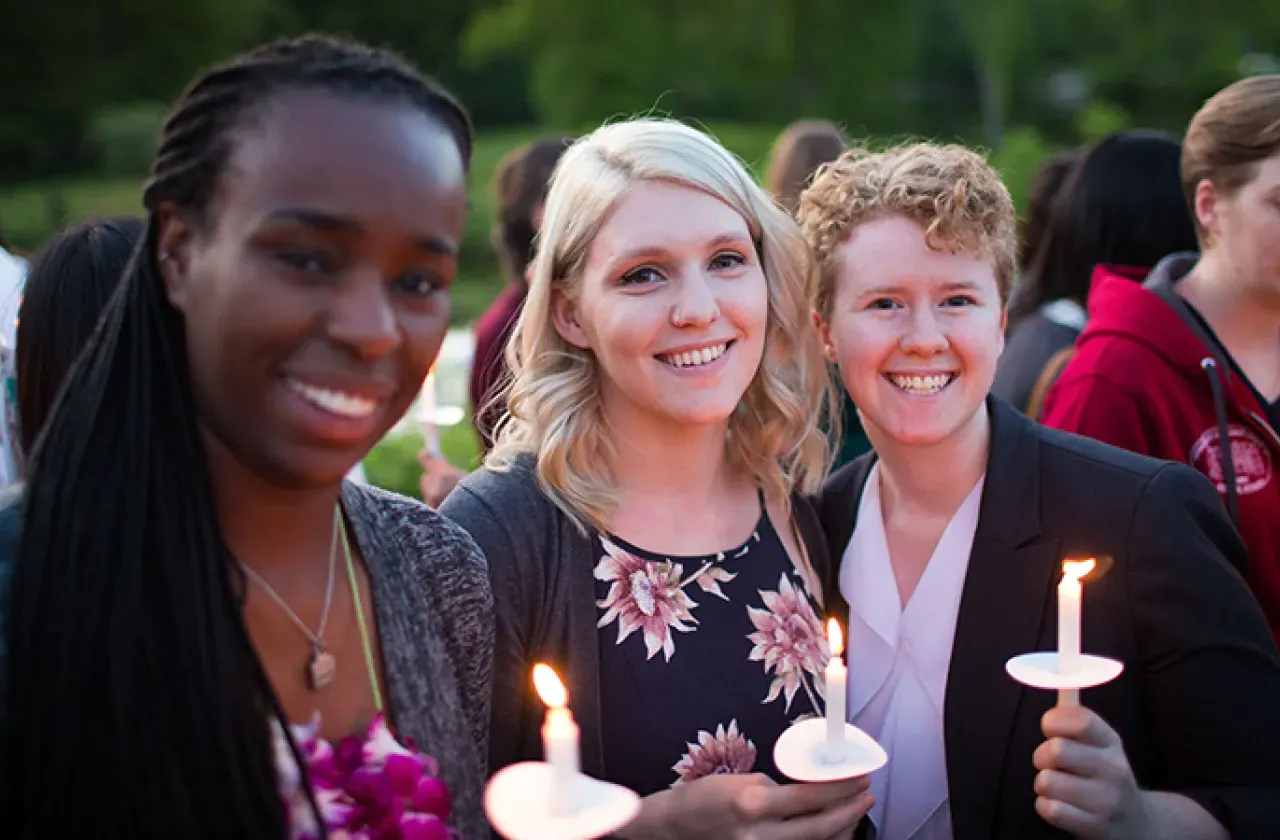 Photo of three students during Illumination